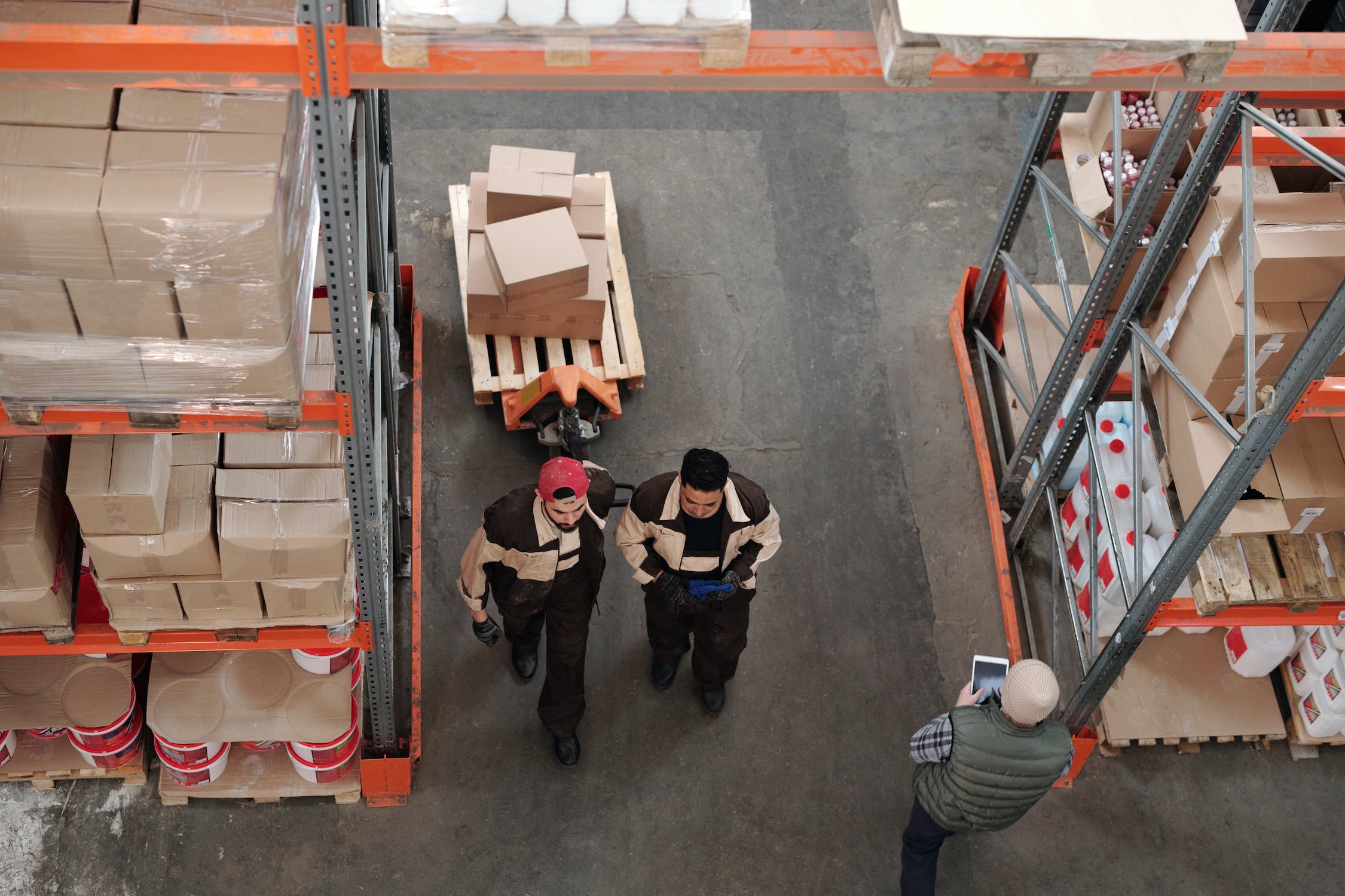 Men Working in a Warehouse using a Vendor Managed Inventory (VMI) system